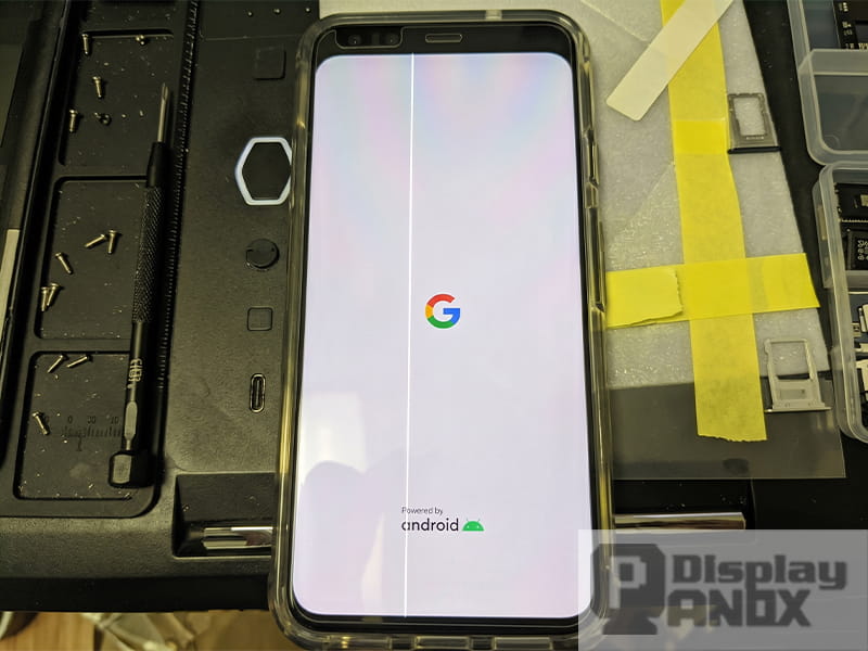 Smartphone display showing a white vertical line defect during screen testing and repair inspection